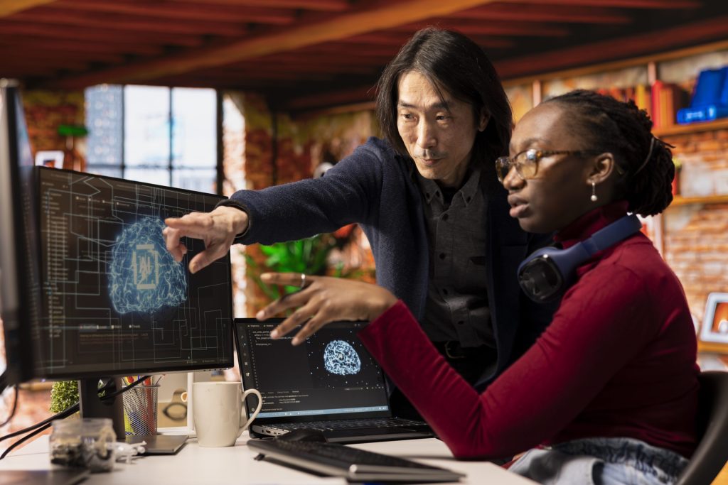man ai startup office cto position overseeing software technician coding scaled.jpg